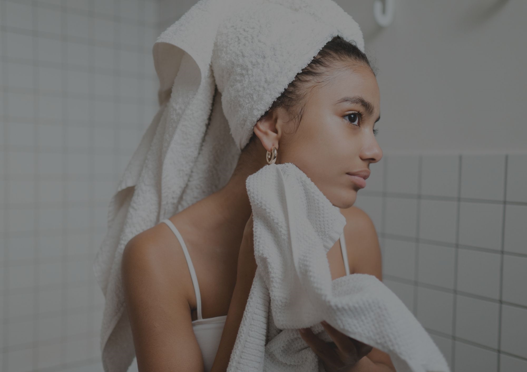 woman cleaning face woman cleaning face